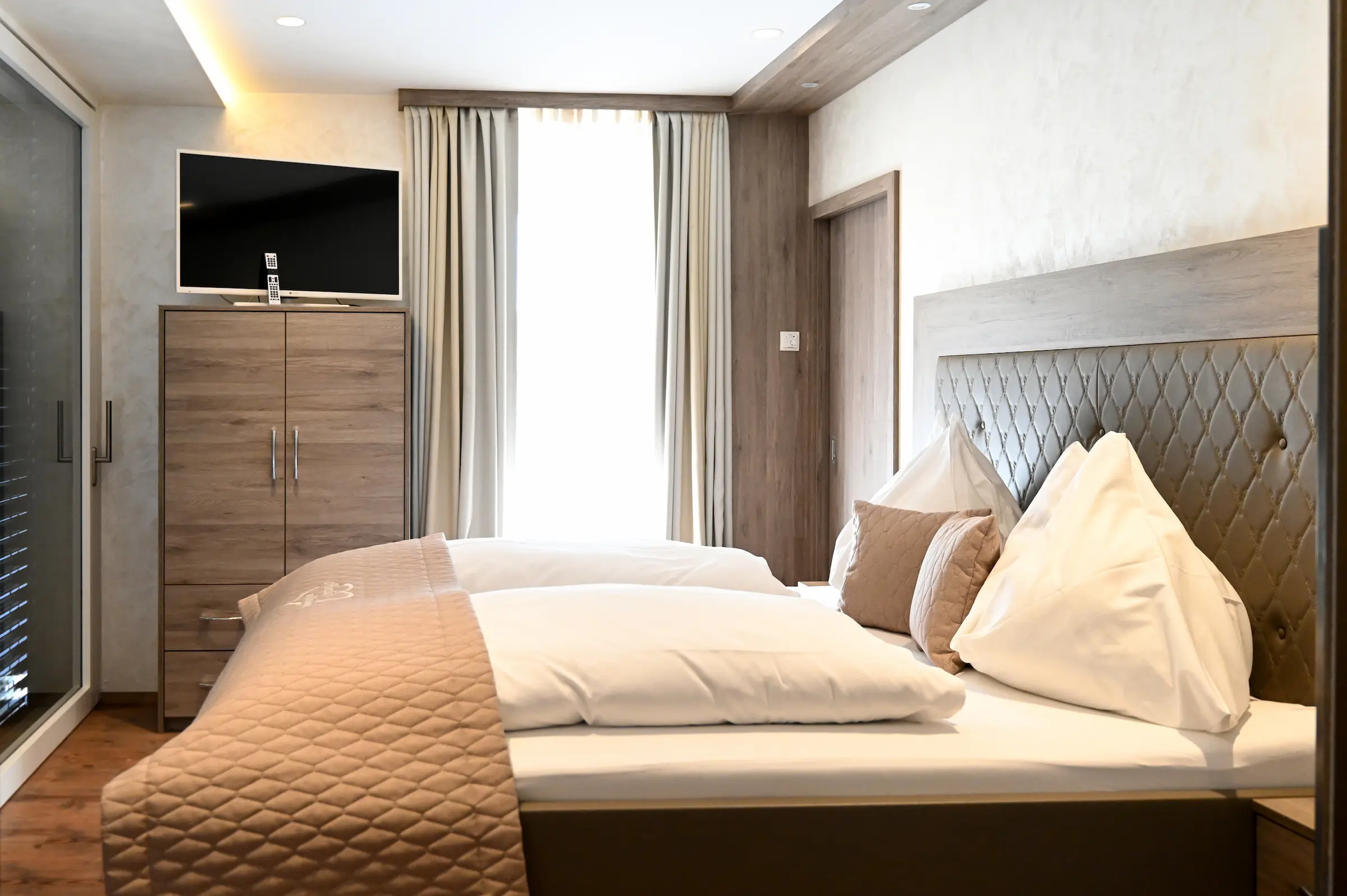 Schlafzimmer im Appartement – Sunchalets Schladming Schlafzimmer im Appartement – Sunchalets Schladming